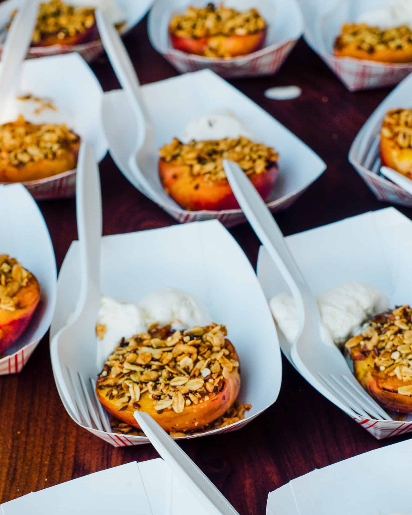 Grilled peaches with crumble (served in paper boats with recyclable forks) for a grilling event we had at Heatherlea Farms.