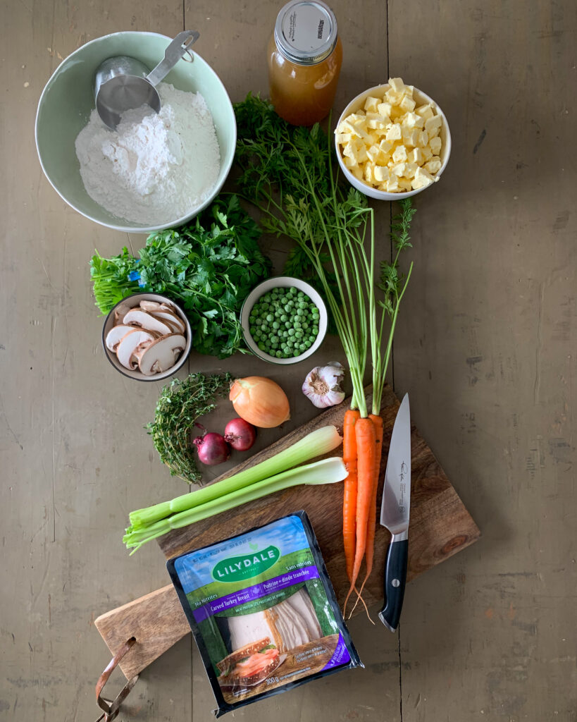 Turkey slices, vegetables and ingredients for a turkey pot pie.