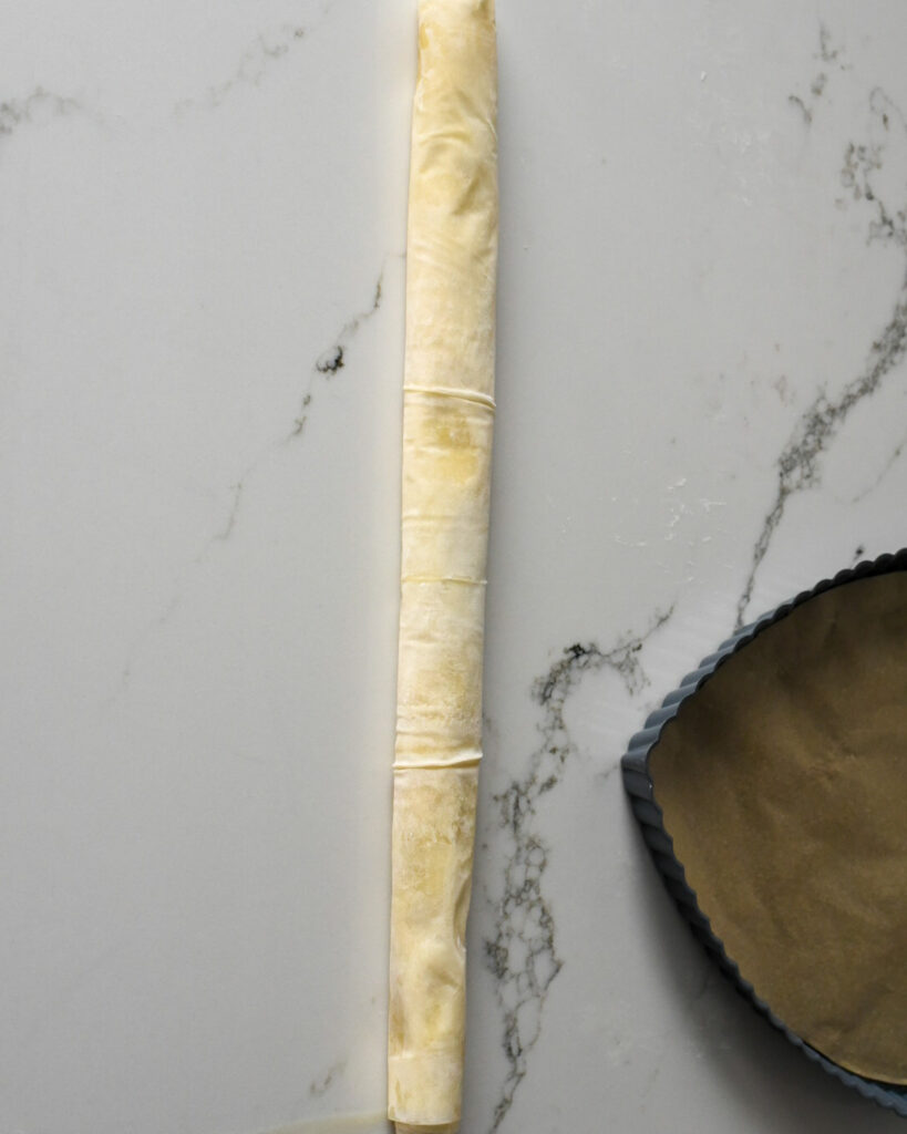 A roll of phyllo with filling.