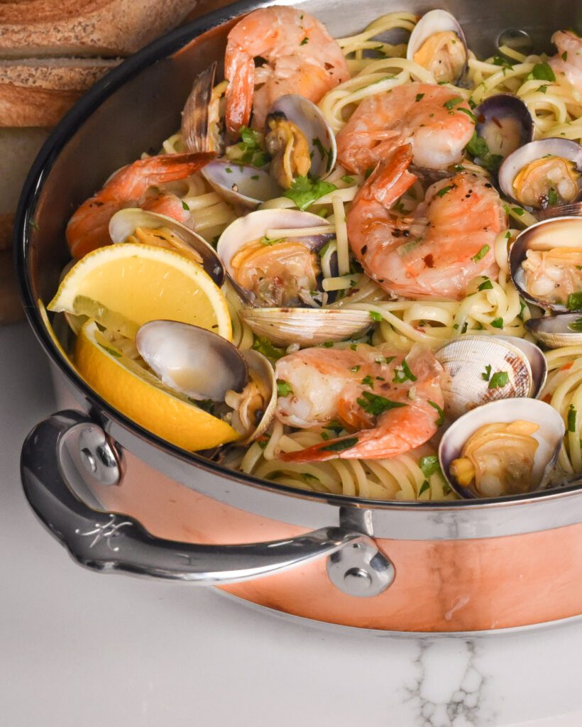 Spicy Linguine with Clams and Shrimp in a copper pan. 