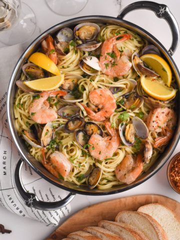 A top down image of Spicy Linguine with Clams and Shrimp.