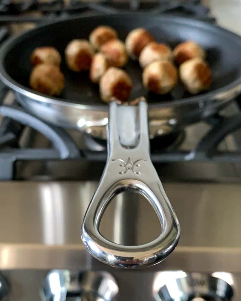 Browning turkey meatballs in a non-stick Hestan skillet. 