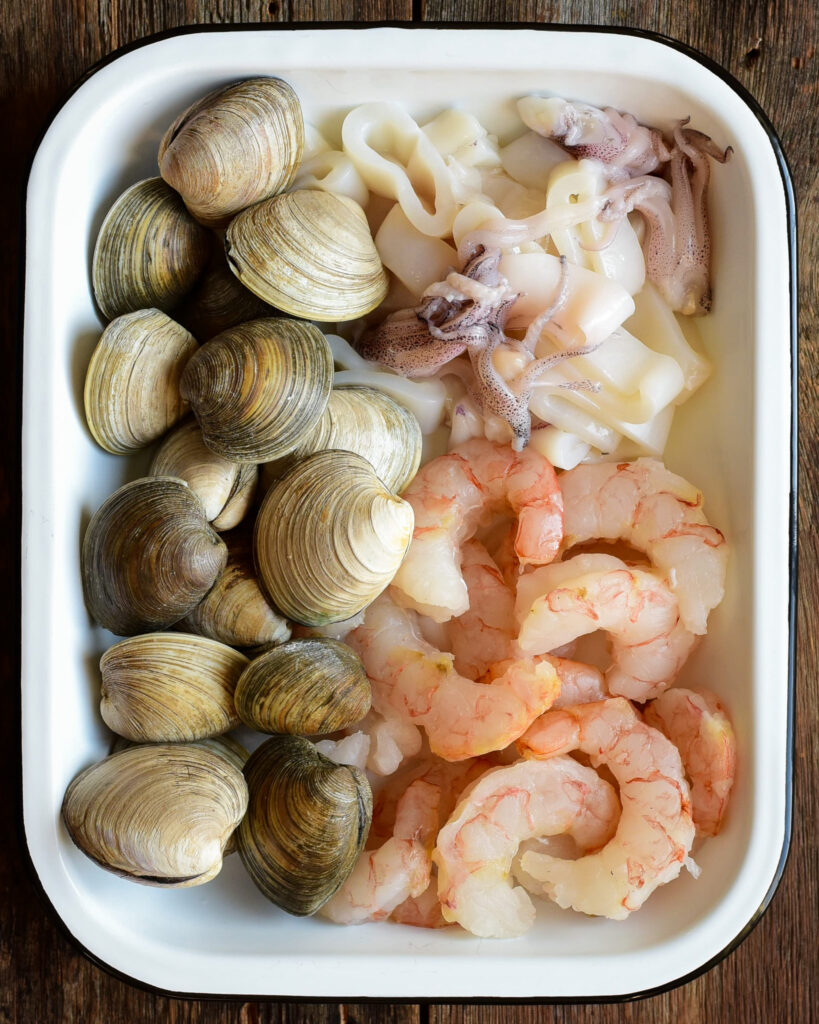 Raw clams, shrimp and squid for cioppino.