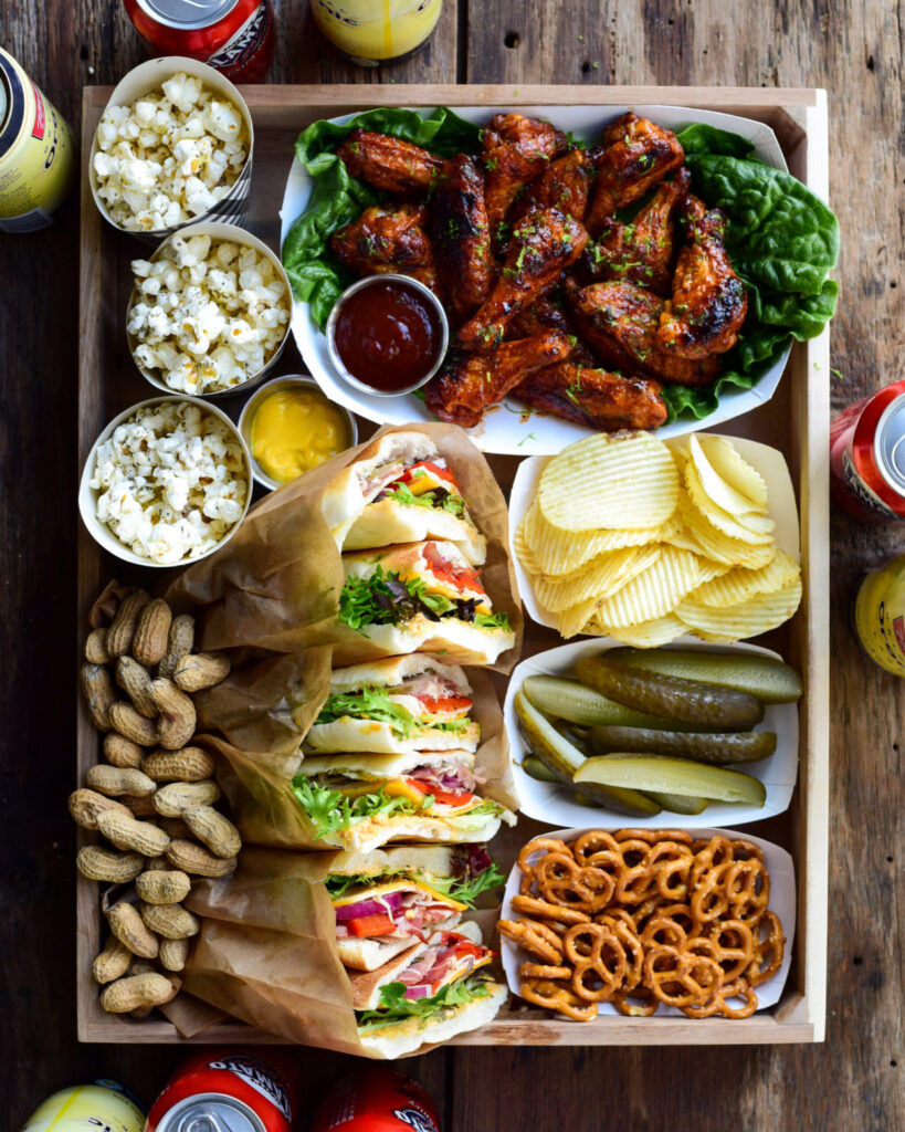 An assortment of game day snacks on a tray.