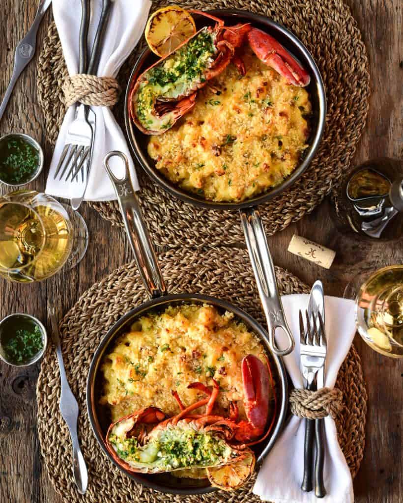 Grilled lobster mac and cheese for two in skillets.