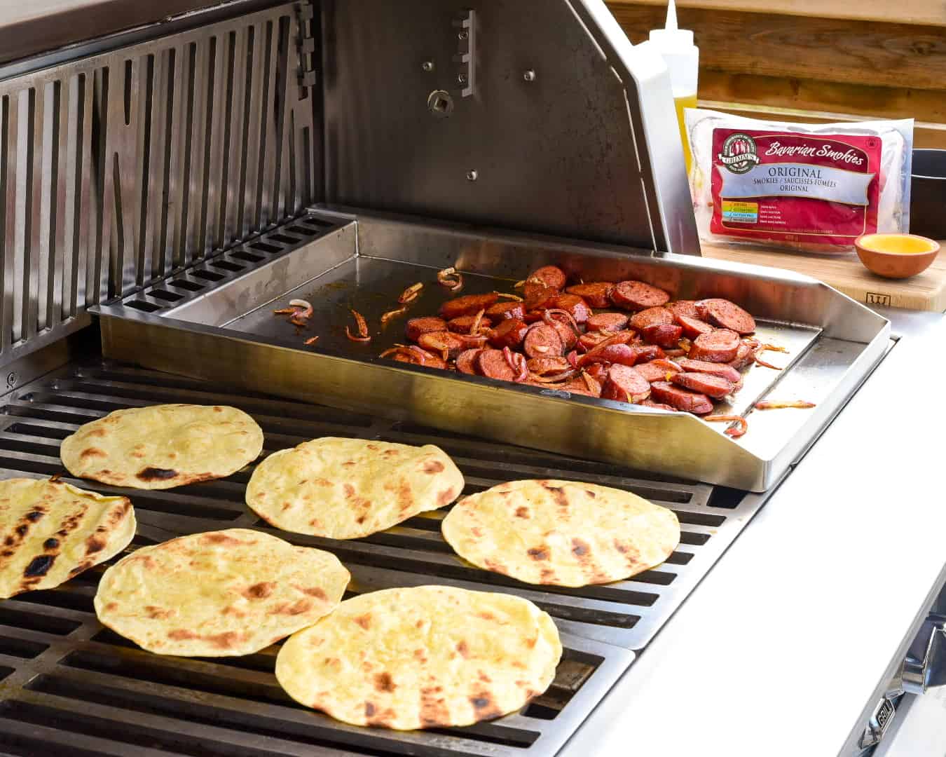 Sliced sausages and tortillas on the grill