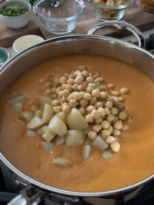 Chickpeas and potatoes added into the pot.