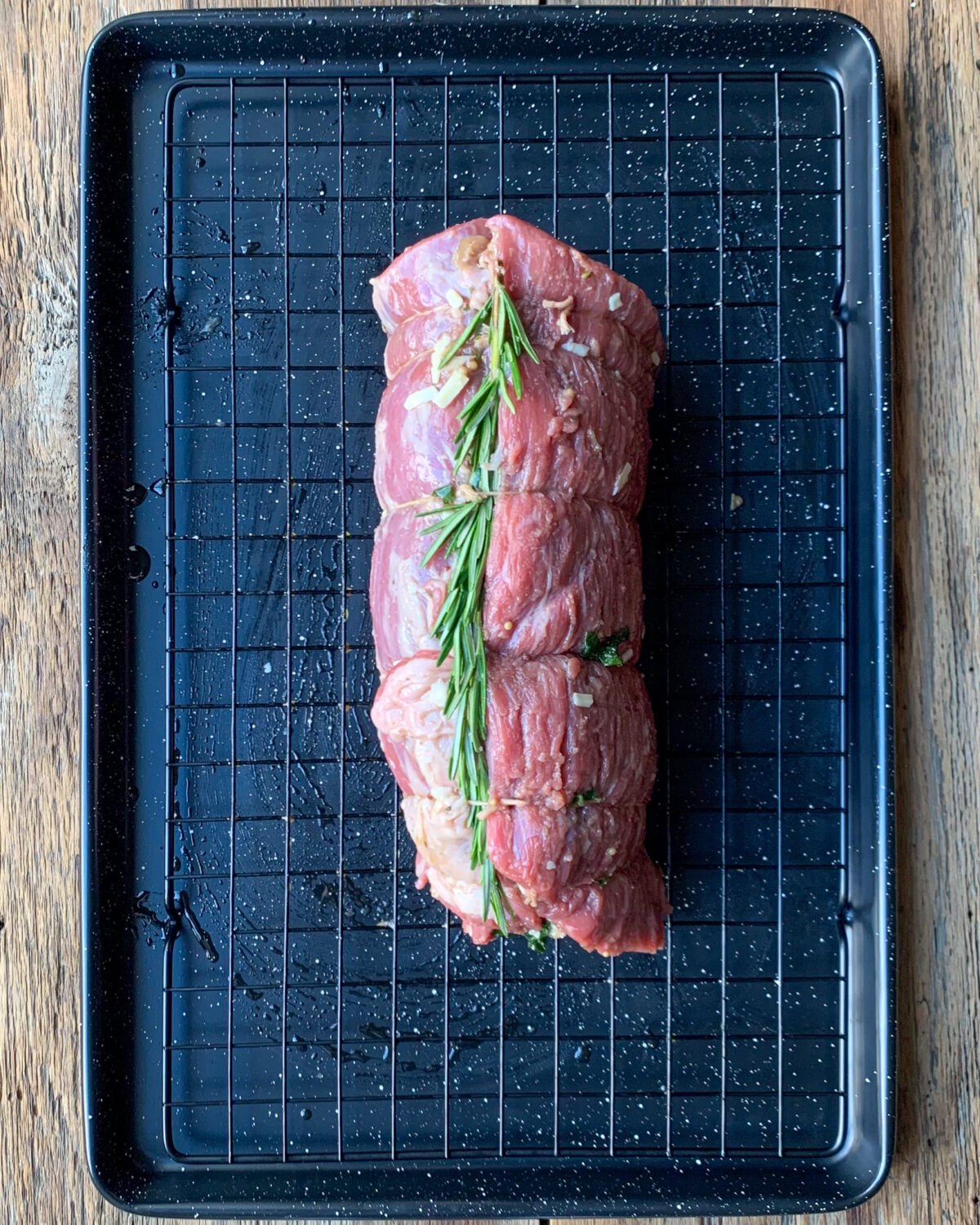 Roll the Stuffed Beef Roast up like a roulade (or jelly roll) and tie with kitchen string at 2-inch (5 cm) intervals.