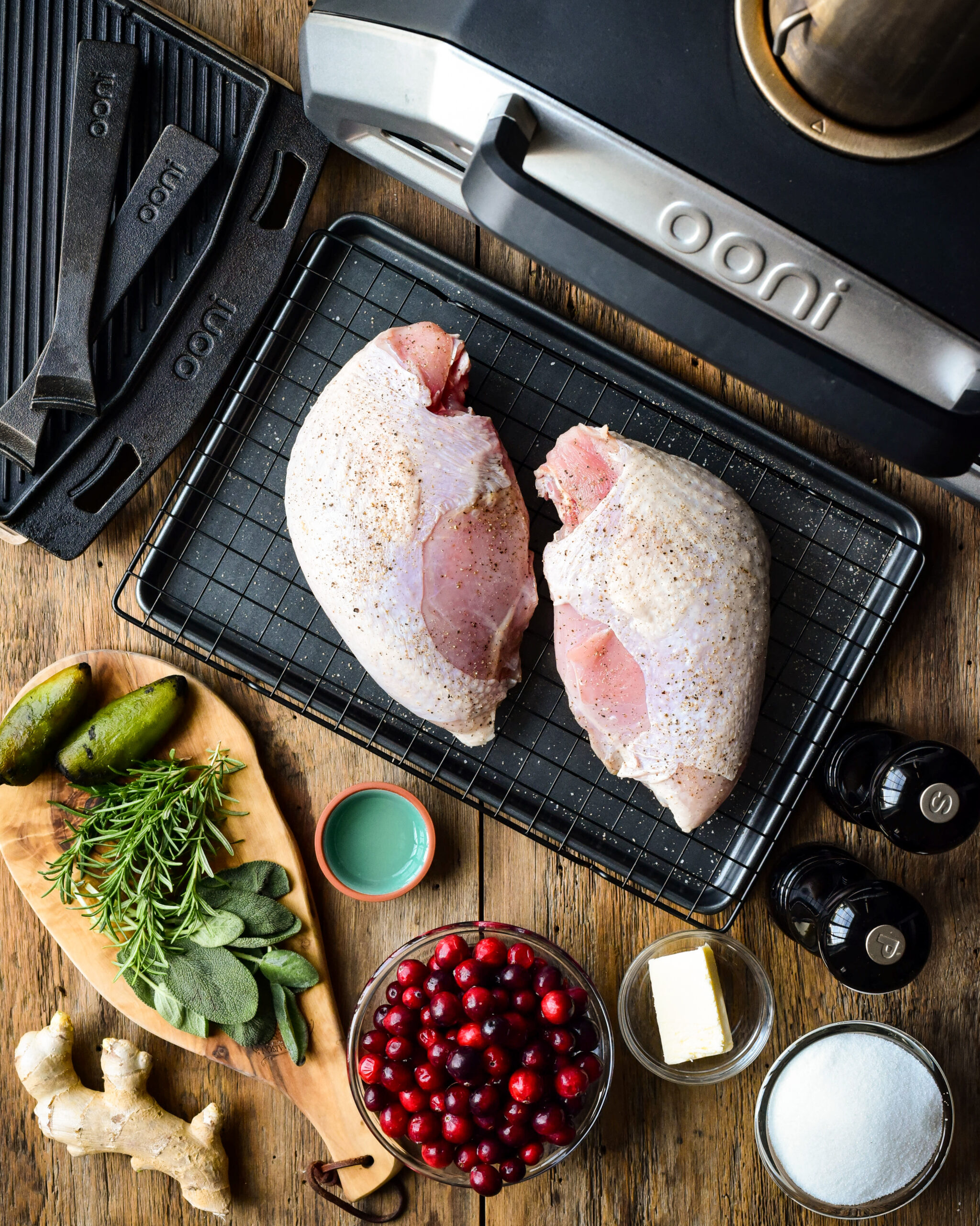 Wood-fired Turkey Breasts with Ginger-Jalapeño-Cranberry Sauce Ingredients layed out beside the Ooni Karu 16