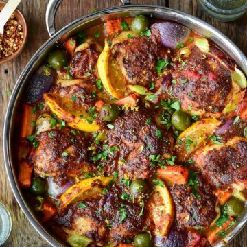 A close up image of Baked Harissa Spiced Chicken in a pan.