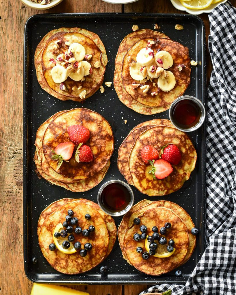 Two Ingredient Banana Pancakes, six stacks with three different toppings.