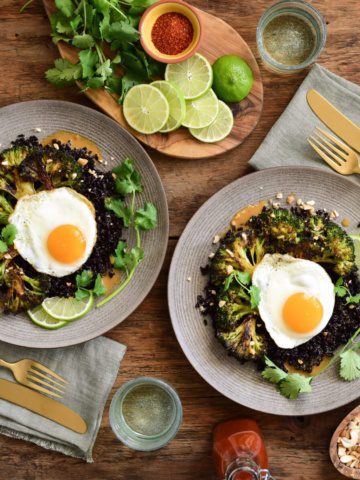 An image of how to plate two plates of fried rice, eggs and broccoli with garnishes.