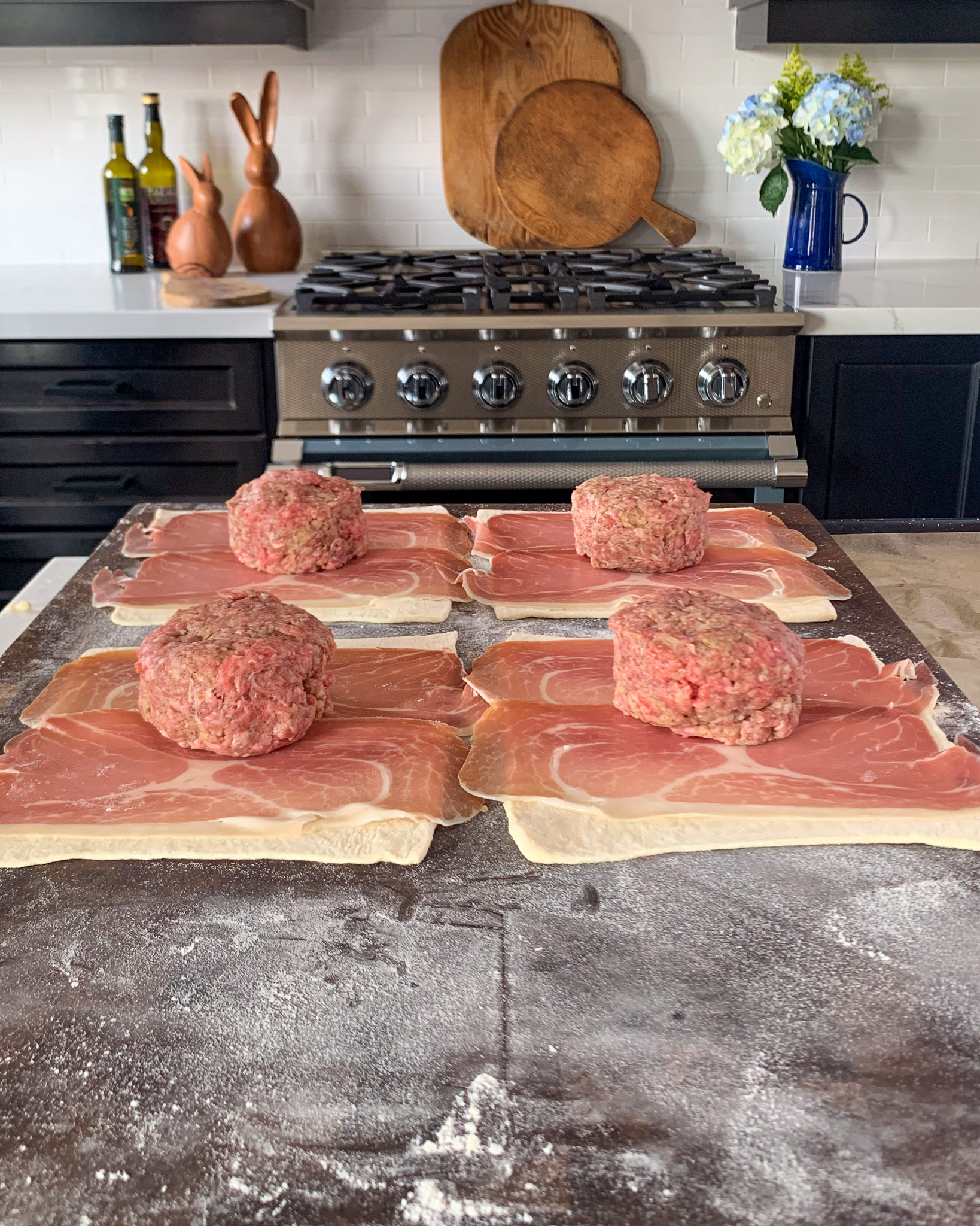 Place the beef pattie ontop of the prosciutto.