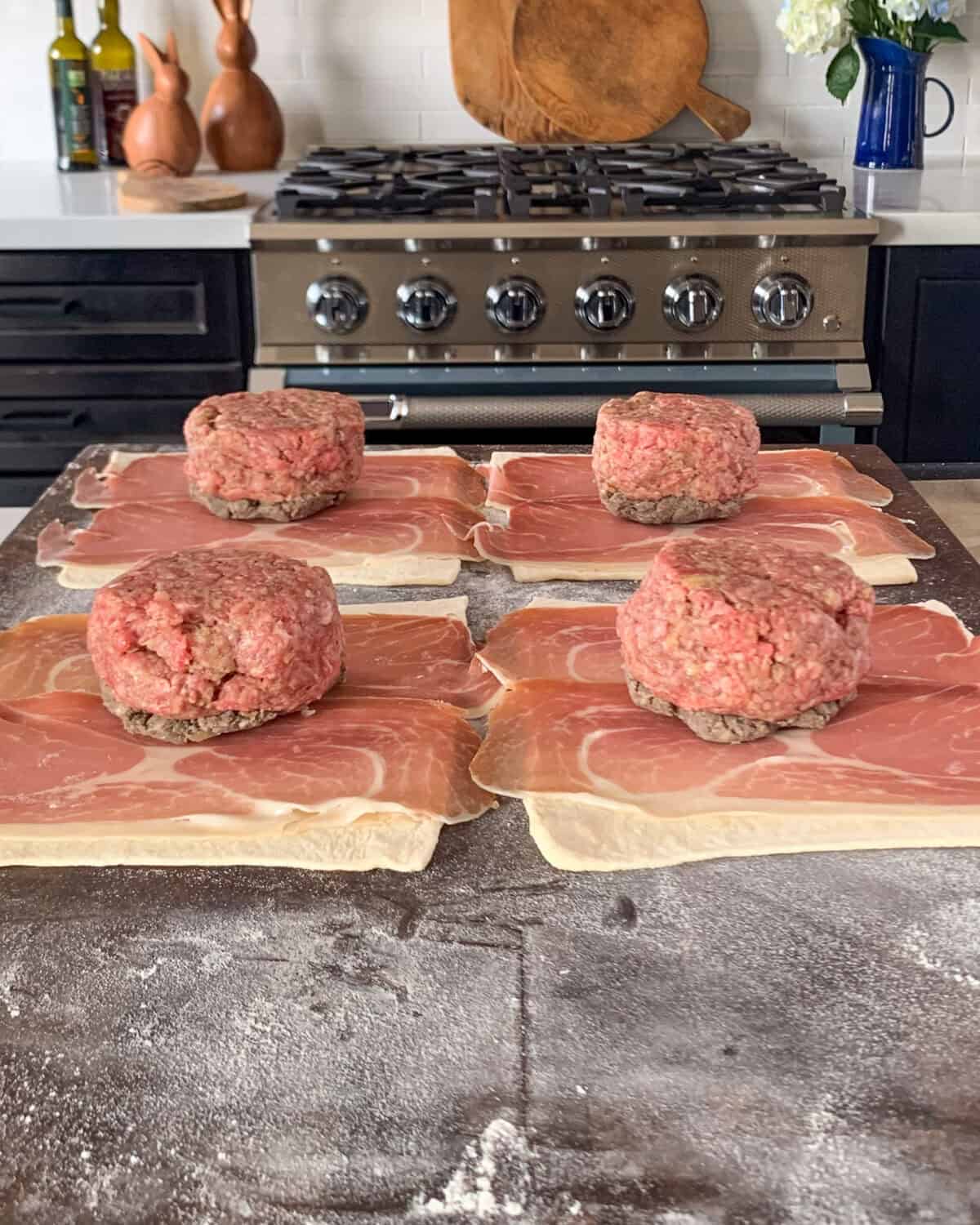 Flip the patty over so the mushrooms sit on top of the prosciutto