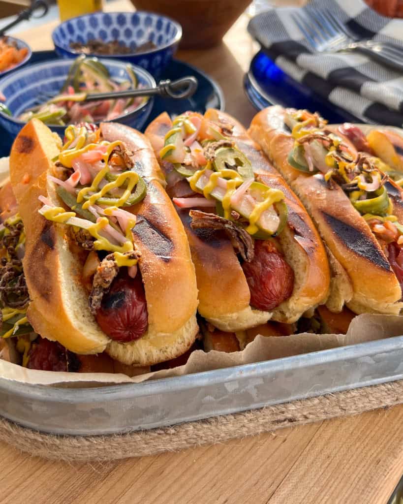 A close-up image of a stack of smokies with all the fixings.