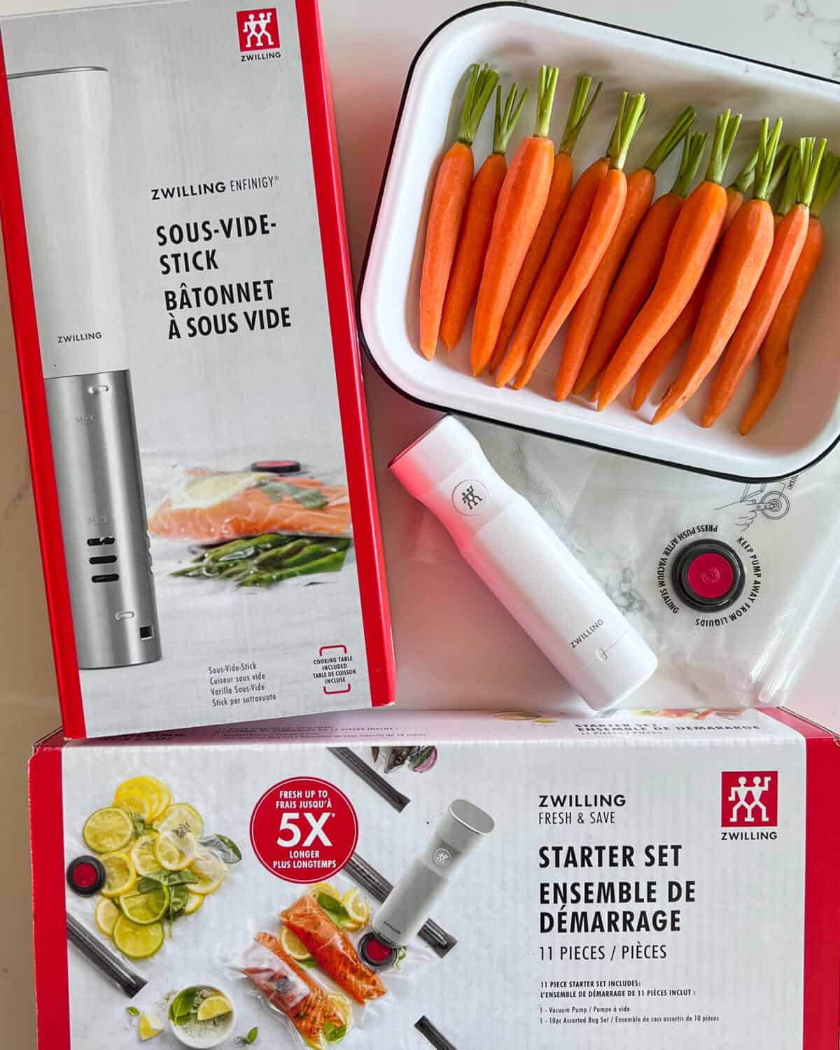 Zwilling sous-vide starter kit boxes with a tray of carrots.