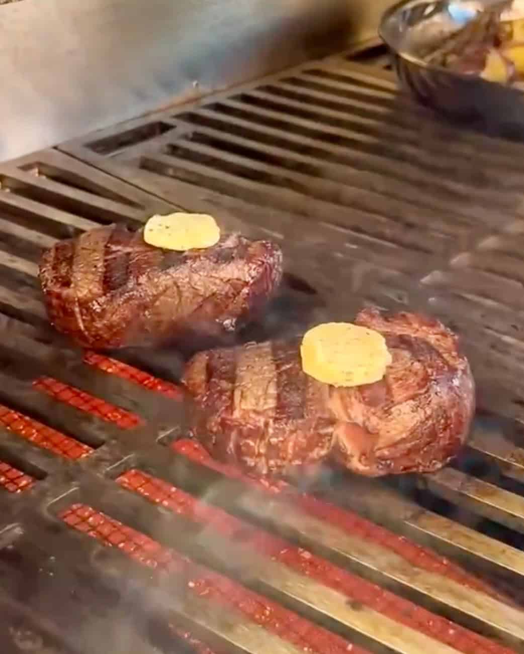 Two thick filet mignon steaks with compound butter.