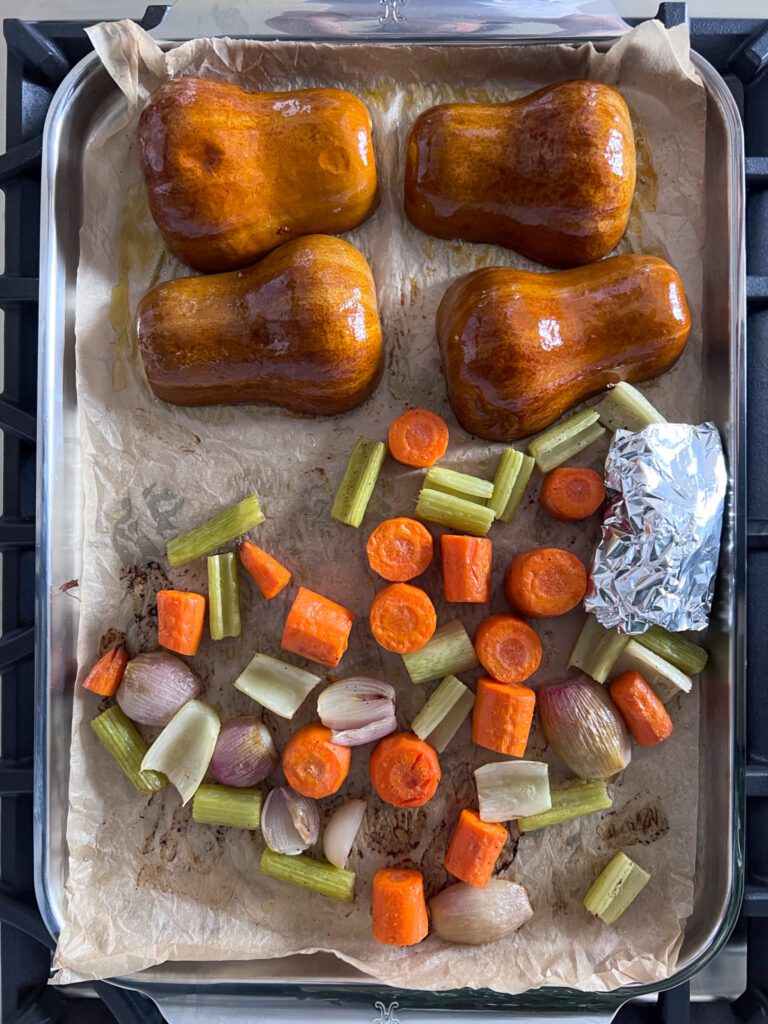 A sheet pan of roasted honeynut squash and vegetables.