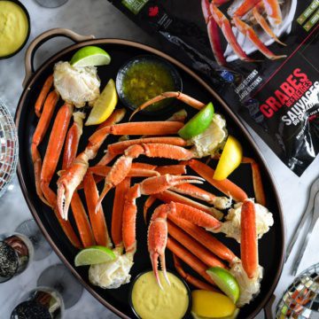 A platter of Wild Caught Snow Crab Legs with Spicy Mustard Dip.