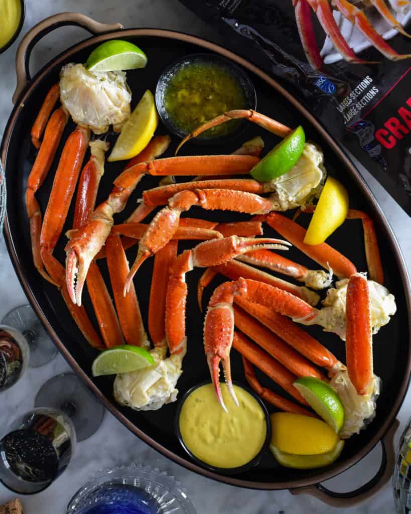 A platter of Wild Caught Snow Crab Legs with Spicy Mustard Dip.
