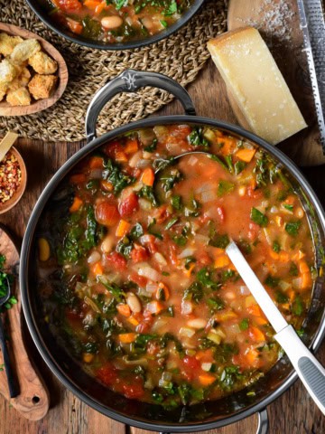 A pot of a rustic vegetable soup.