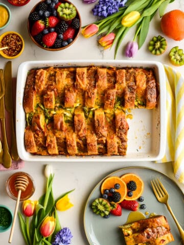 Savoury French Toast Casserole served with fresh fruit for Easter brunch.