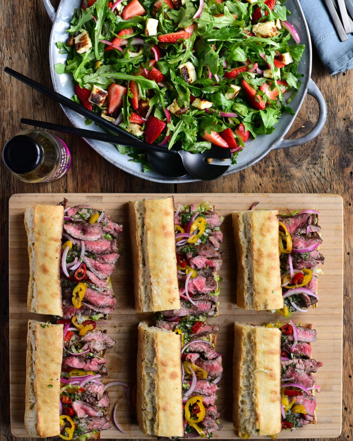 Six grilled steak sandwiches with a with A Grilled Halloumi & Strawberry Salad