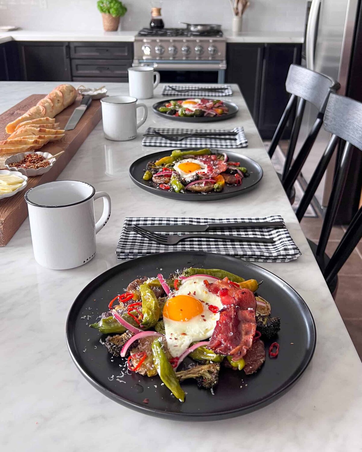 A kitchen island with three place settings of Parmesan Smashed Potatoes and Eggs.