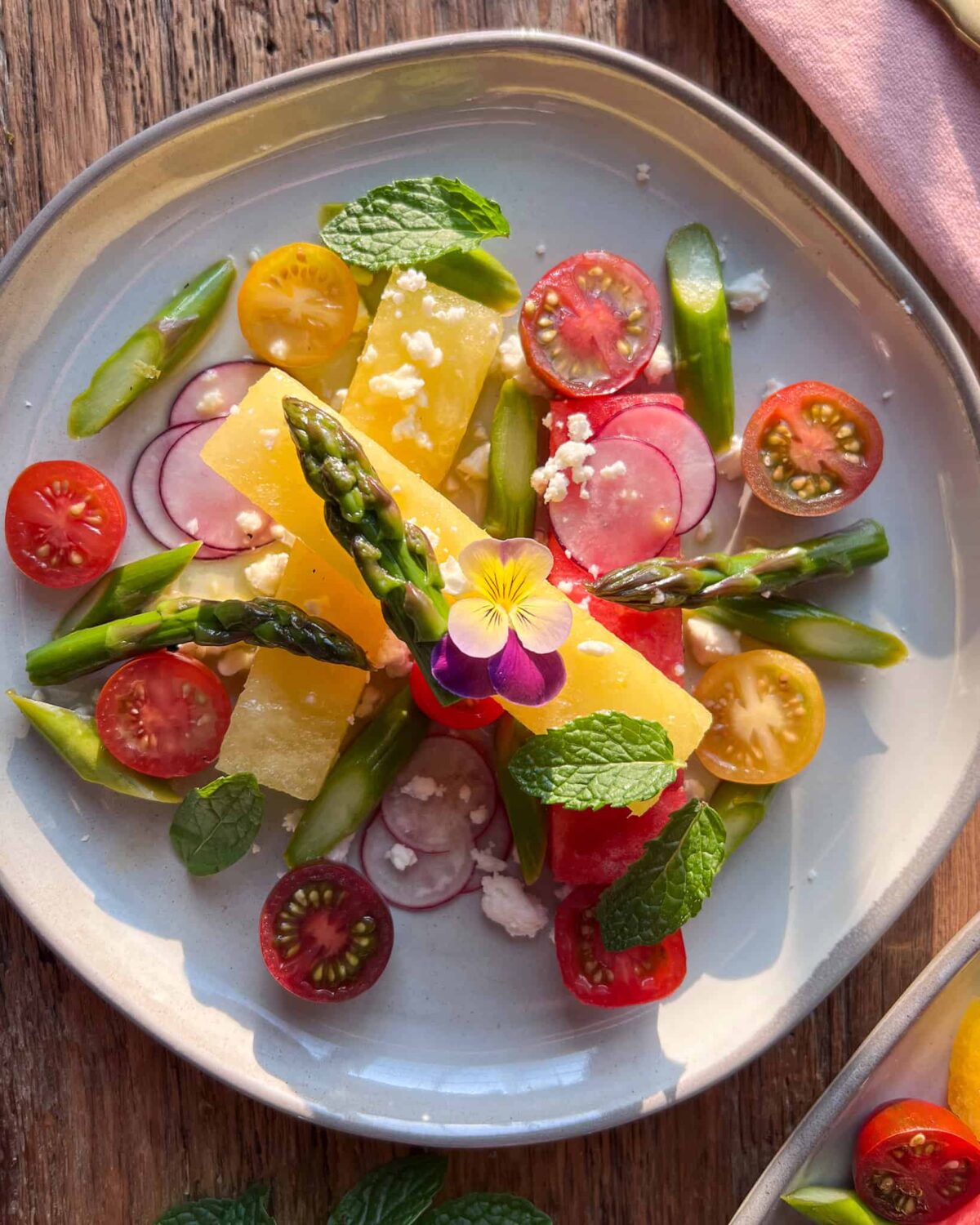 An elegant compressed watermelon, asparagus, radish and feta salad.