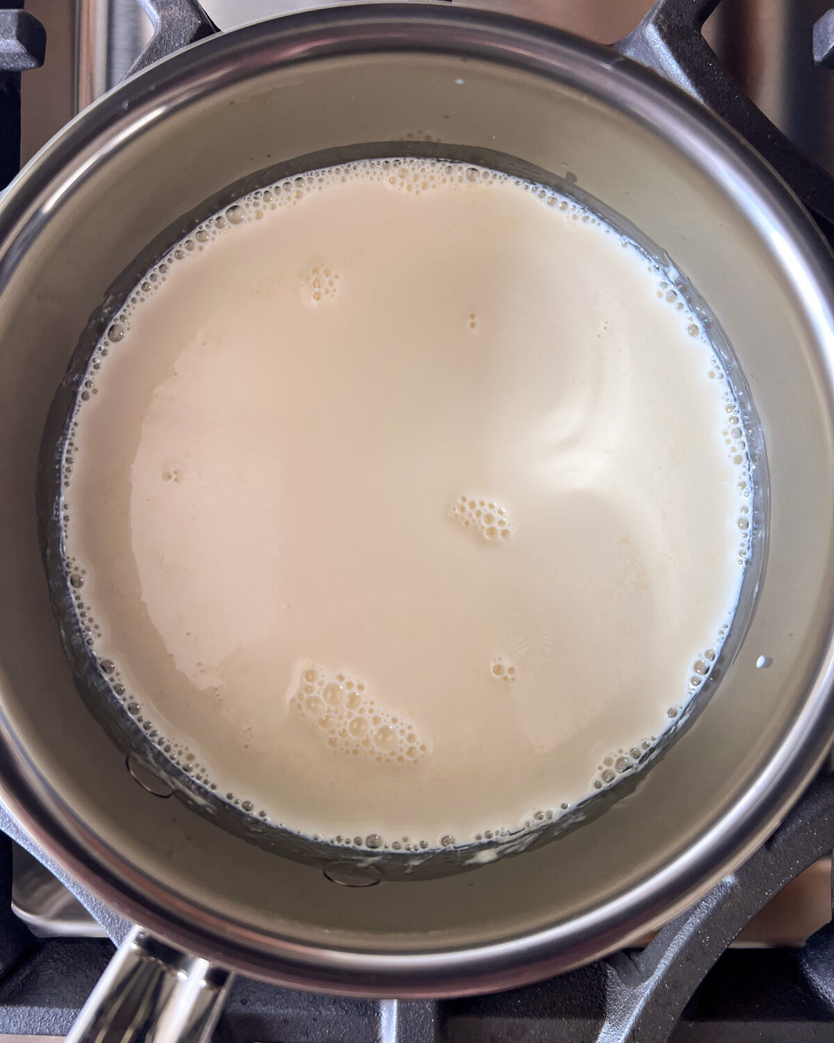 Warm the cream in a pot until bubbles appear at the edges.