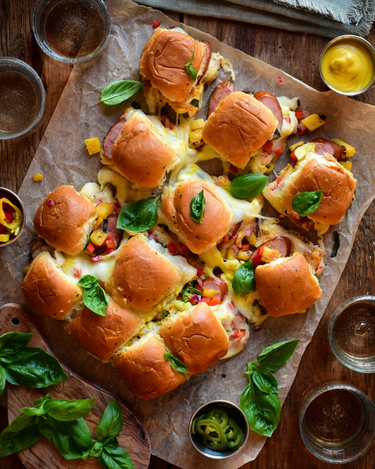 Pull apart sliders with ham garlic sausages and pineapple salsa.
