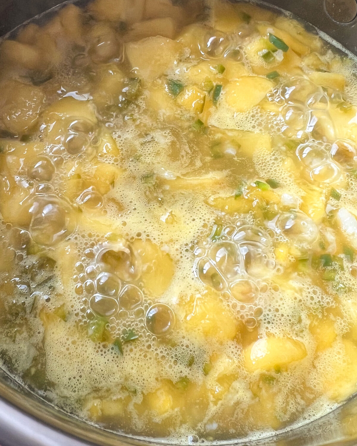Bring a small saucepan with peaches, jalapeños, garlic, lemon zest, lemon juice, water, honey to a boil.