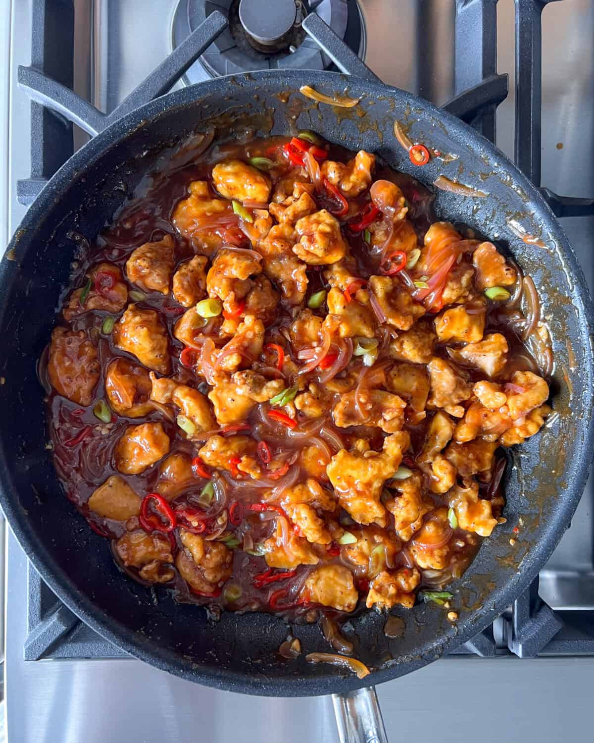 Toss to coat all the chicken pieces evenly in the chili sauce.