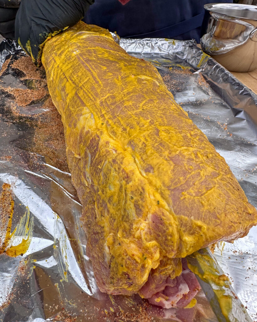 Pork loin rubbed with a mustard binder.