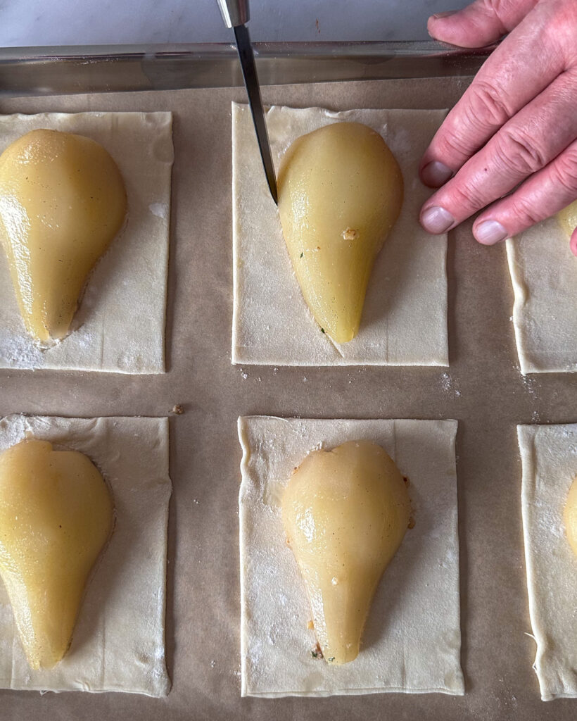 Score the puff pastry around the pear. 
