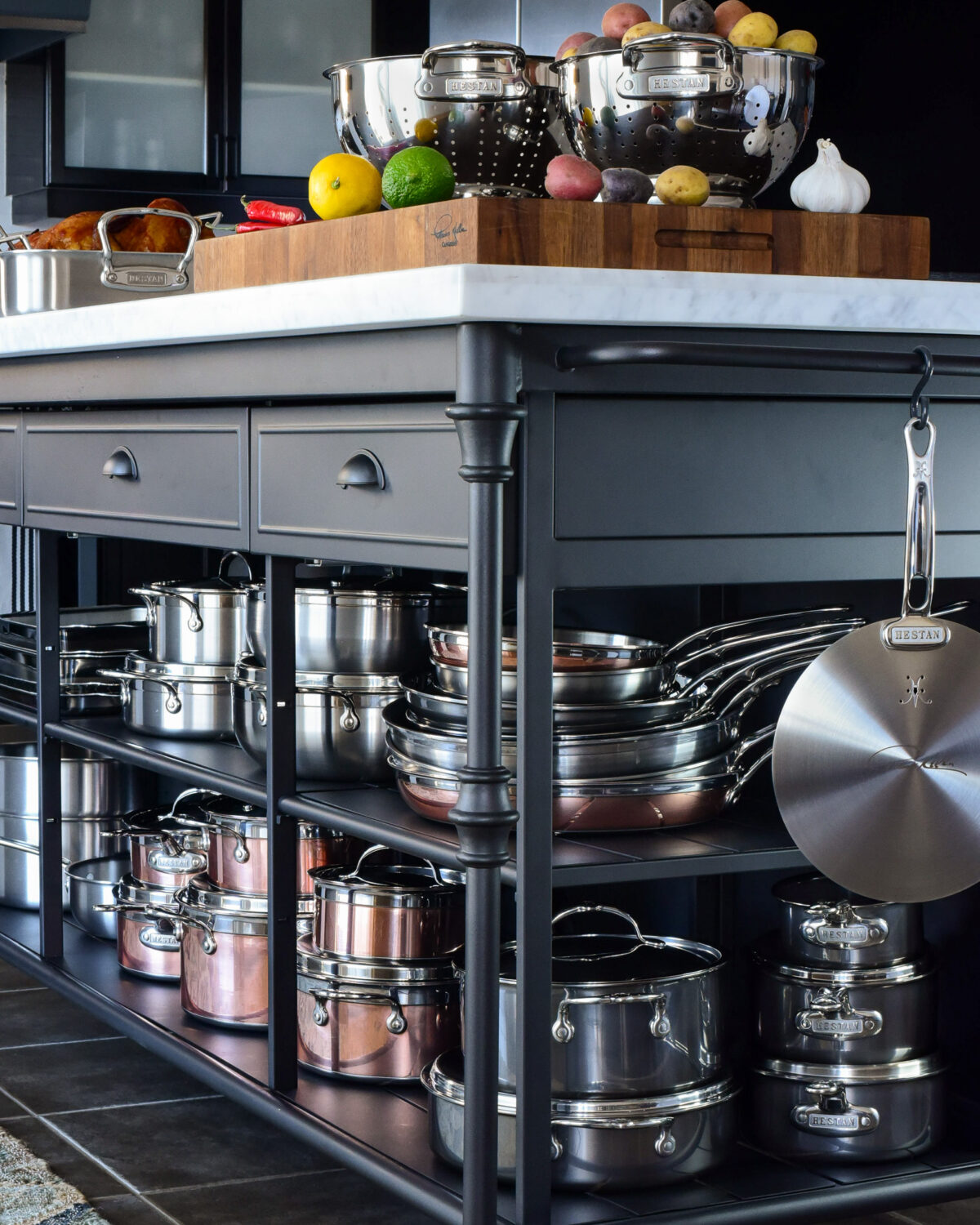 A collection of Hestan Culinary cookware on a kitchen island.