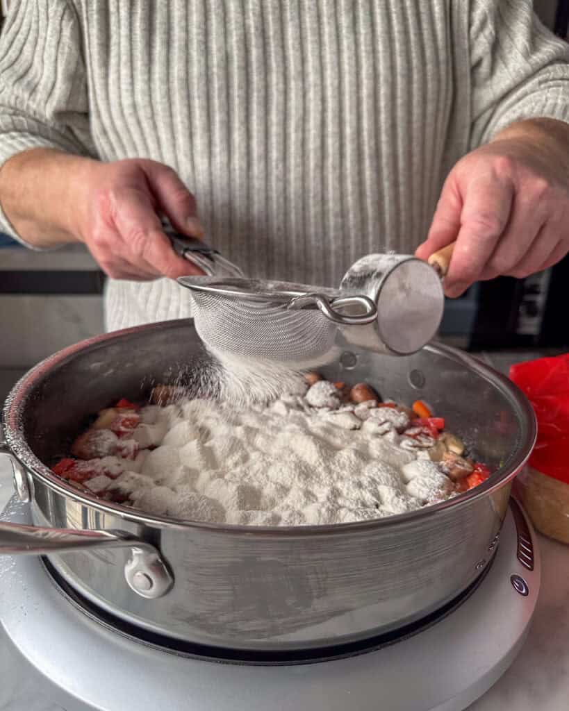 Sift in the flour and cook for one minute while stirring