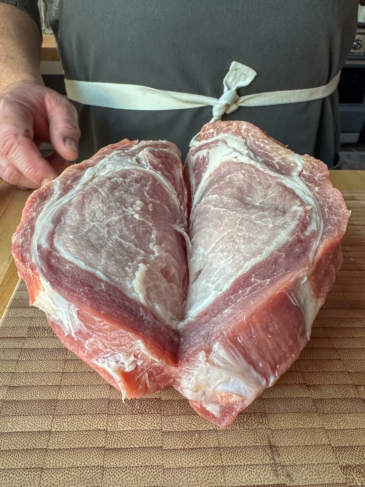 With a sharp knife, carefully slice a pocket in each pork chop in the middle of its thickness, almost to the bone.