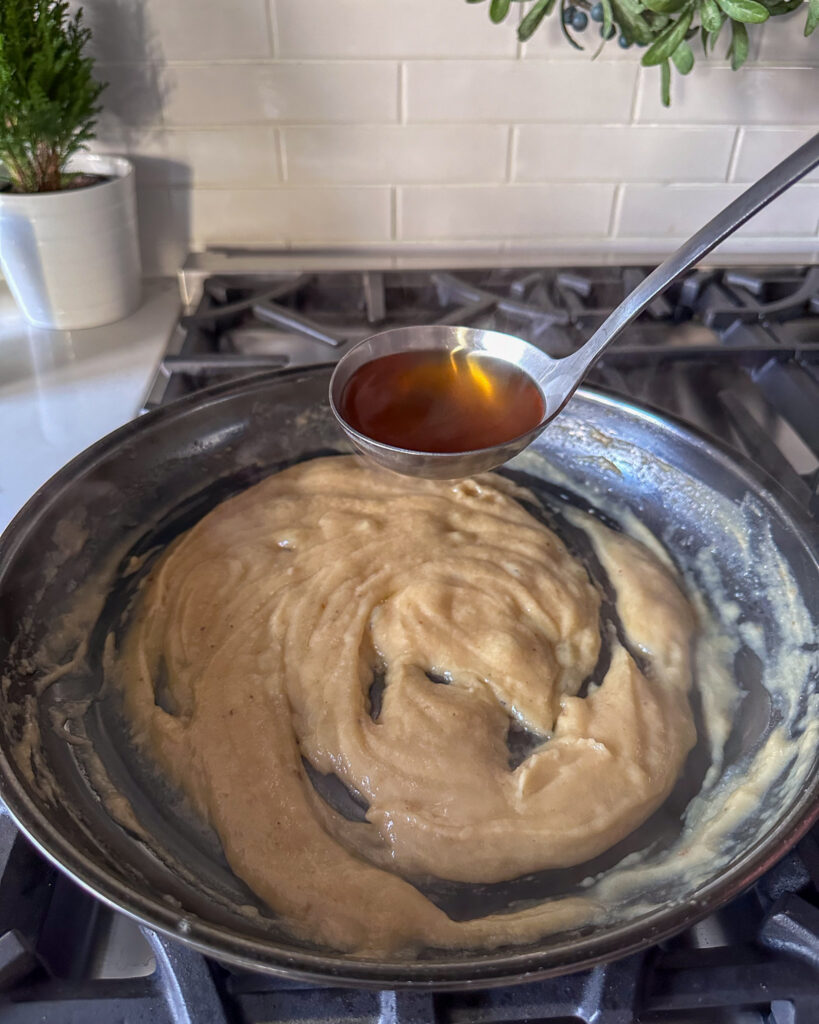 Add the hot stock ½ cup at a time into the gravy.