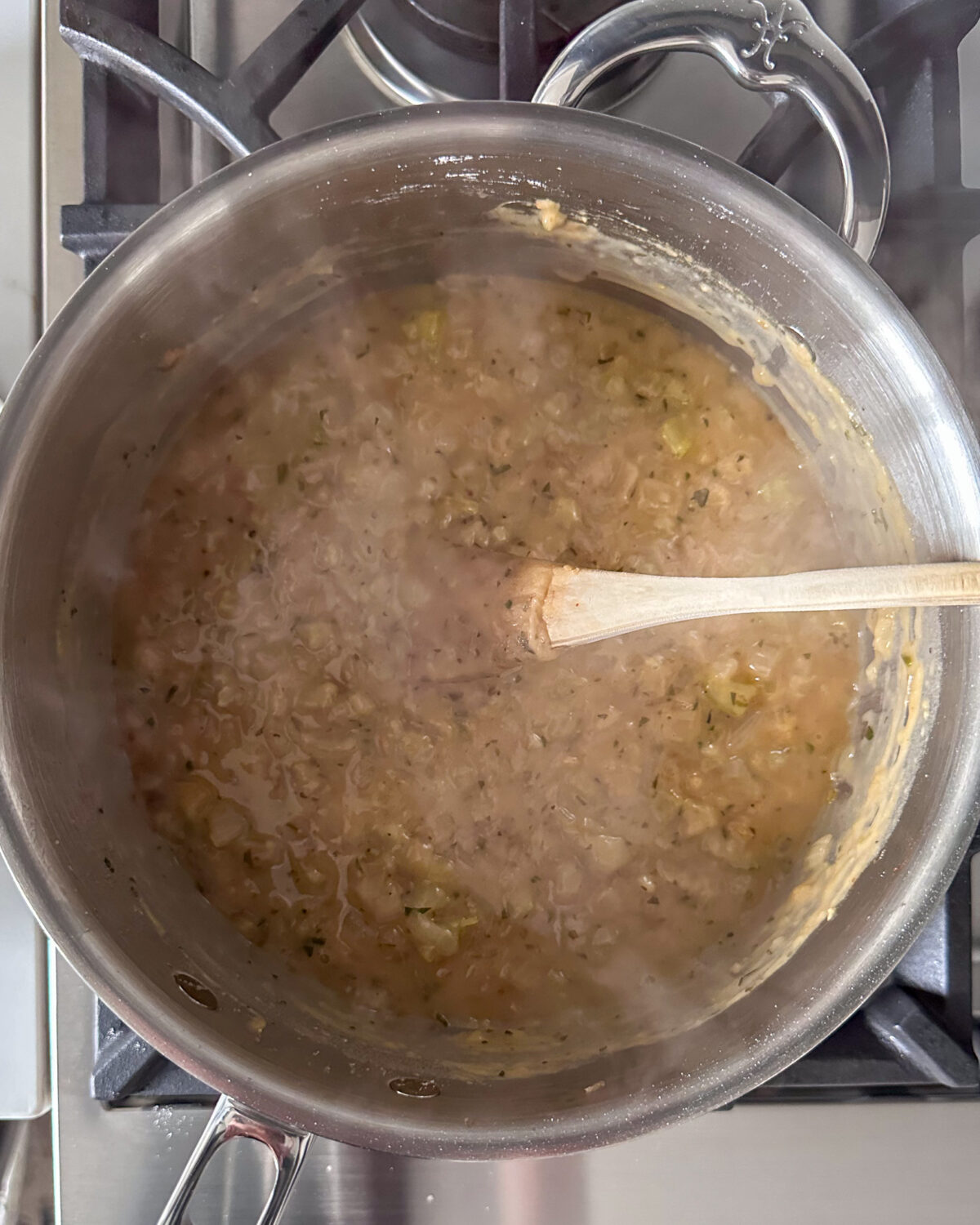 Add the warm chicken concentrate, ¼ cup at a time, stirring constantly, and scraping the pan clean before adding the next ¼ cup. Next add the warm half & half, ½ cup at a time, stirring constantly, and scraping the pan clean before adding the next ½ cup.