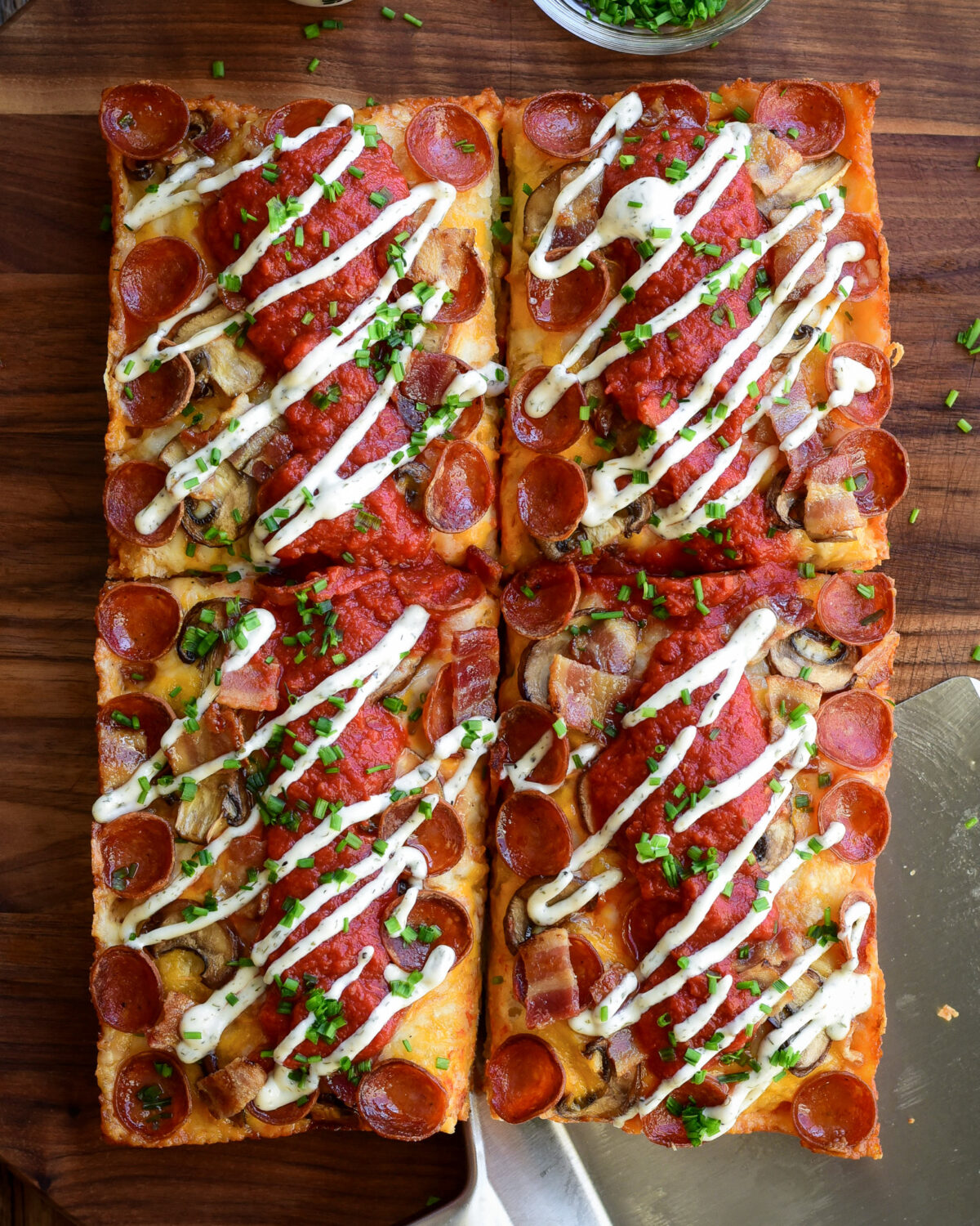 A Detroit-Style Pizza topped with Canadian pizza ingredients.