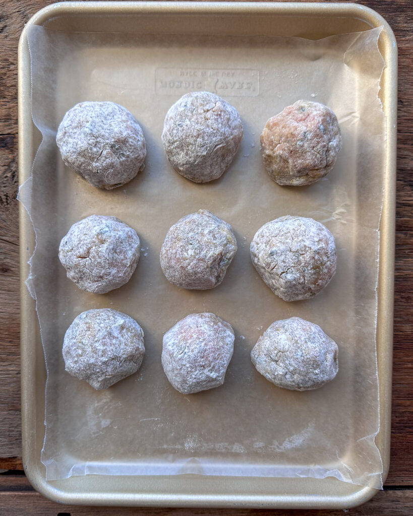 Roll the meatball in flour to form a ball,