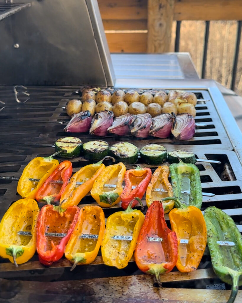 Rows of colourful vegetable skewers on the grill.