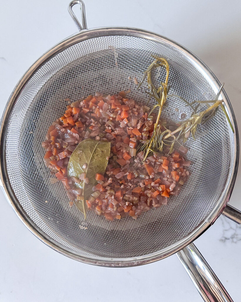 Pour the gravy mixture through a fine mesh strainer.