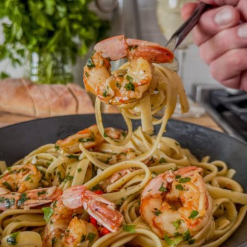 A forkful of spicy garlic shrimp pasta.