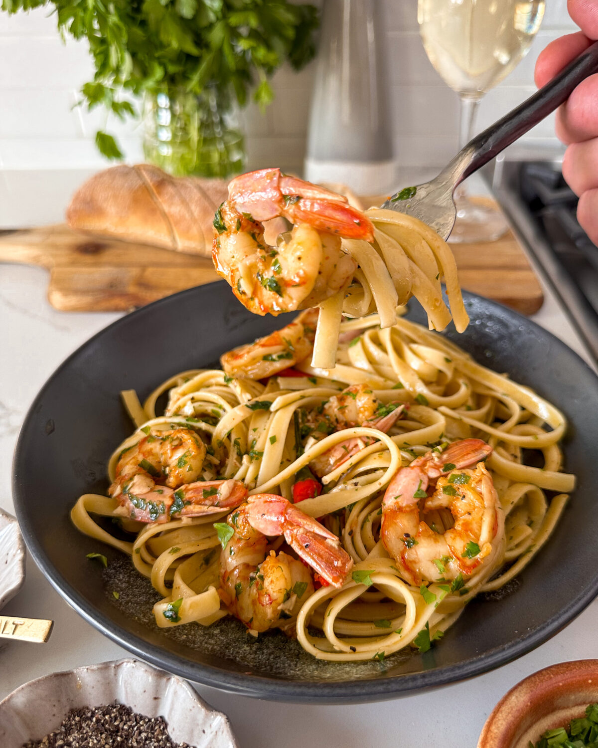 A forkful of a spicy garlic shrimp pasta.
