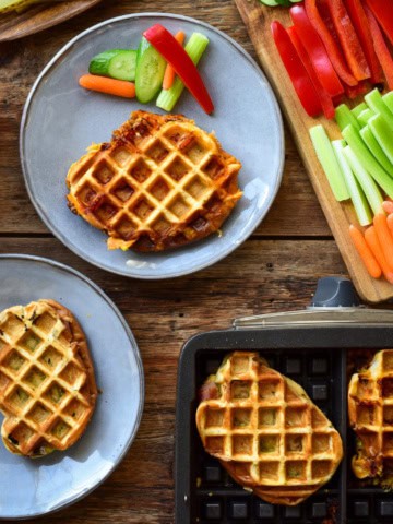 Waffle iron panini served with veggies.