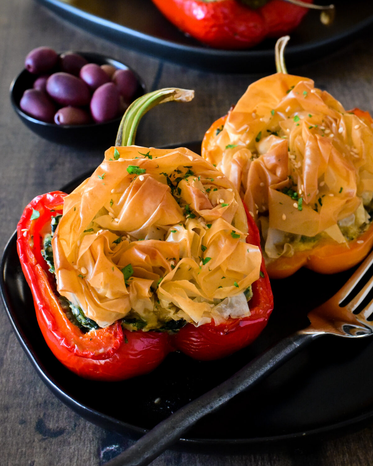 Spanakopita Stuffed Peppers with a crispy phyllo rose topping.