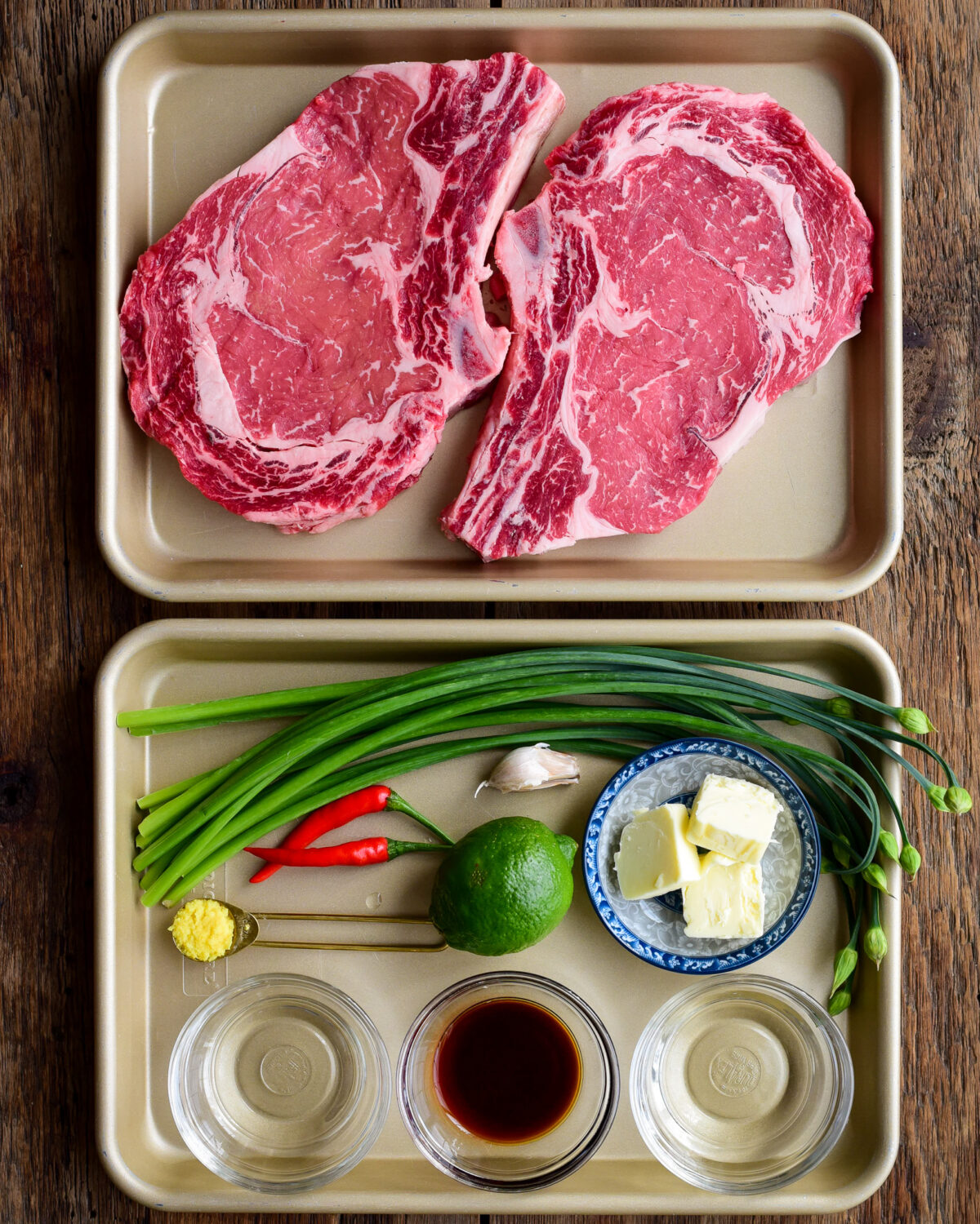 Ingredients laid out for a grilled rib eye steak recipe.