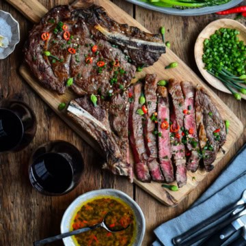 Two Grilled Ribeye Steaks served with an Asian-Inspired Sauce